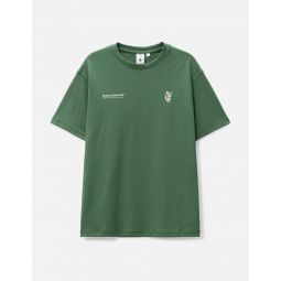 PUMA X QGC MODERN GRAPHIC T-SHIRT DEEP FOREST