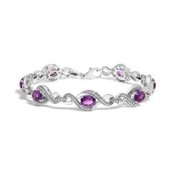 .925 sterling silver 1/10 cttw natural round diamond and 7x5mm oval amethyst cross tennis bracelet